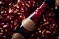 a bottle of champagne and glitter. New Year and Christmas background Royalty Free Stock Photo