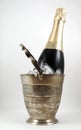 A bottle of champagne in an ice bucket isolated Royalty Free Stock Photo