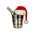 A bottle of champagne in an ice bucket and a Santa Claus hat isolated on white background Royalty Free Stock Photo