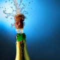 Bottle of champagne with splashes Royalty Free Stock Photo