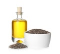 Bottle of chia oil, bowl and seeds on white Royalty Free Stock Photo