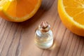 A bottle of orange essential oil with fresh oranges Royalty Free Stock Photo