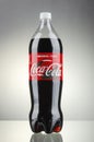 Bottle of Coca-Cola drink isolated on gradient background. Royalty Free Stock Photo