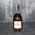 Bottle of Cognac on gray background