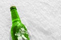 Bottle of cold beer on the snow. Royalty Free Stock Photo