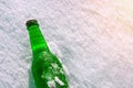 Bottle of cold beer on the snow. Royalty Free Stock Photo