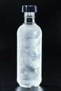 Bottle of cold vodka on dark background Royalty Free Stock Photo