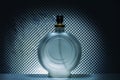 Bottle of cologne perfume on gray light background