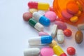 Bottle of colorful pills white background Royalty Free Stock Photo