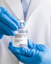 Bottle of coronavirus vaccine in the hands of doctors