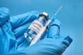 A bottle of COVID-19 Sputnik V vaccine and a syringe with an injection needle against coronavirus infection in the