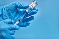 A bottle of COVID-19 Sputnik V vaccine and a syringe with an injection needle against coronavirus infection in the
