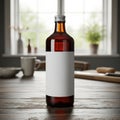 Bottle of dark liquid placed on a rustic wooden table near a window Royalty Free Stock Photo