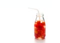 Bottle delicious refreshing drink of vibrant watermelon with drinking straw, infusioned water, soft focus and warm tone