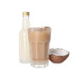 Bottle of delicious syrup, glass of iced coffee and coconut isolated on white