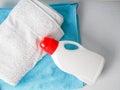 Bottle of detergent and clean towels on washing machine indoors, space for text. Laundry day Royalty Free Stock Photo