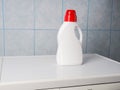 Bottle of detergent and clean towels on washing machine indoors, space for text. Laundry day Royalty Free Stock Photo