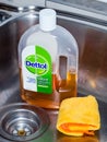 A bottle of Dettol in a kitchen sink. A household disinfectant.