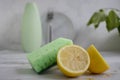 Bottle of dish detergent, lemon, cleaning cleanup chemical sterilize sponge on a light background