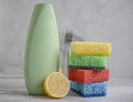 Bottle of dish detergent, lemon, cleaning detergent cleanup chemical sterilize sponge on a light background