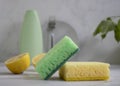 Bottle of dish detergent, lemon concept domesti, antiseptic detergent cleanup chemical sterilize sponge on a light background