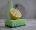 Bottle of dish detergent, lemon disinfecdomesti, antiseptic detergent cleanup chemical sterilize sponge on a light background