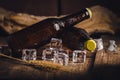 Bottle Draft Beer and ice on wooden table Royalty Free Stock Photo