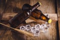 Bottle Draft Beer and ice on wooden table Royalty Free Stock Photo