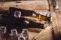 Bottle Draft Beer and ice on wooden table Royalty Free Stock Photo