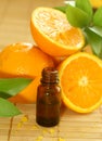 bottle of essence oil and oranges Royalty Free Stock Photo