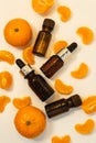 A bottle of essential oil, Aromatic tangerine oil in a dark bubble, cosmetic oil from tangerine. Bottles with sweet orange Royalty Free Stock Photo