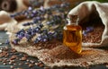 Bottle of essential oil with flax seeds and lavender flowers Royalty Free Stock Photo