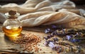 Bottle of essential oil with flax seeds and lavender flowers on wooden background Royalty Free Stock Photo