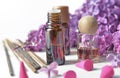 Bottle of essential oil and incense with purple lilac flower Royalty Free Stock Photo