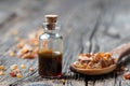 A bottle of myrrh essential oil with myrrh resin on a spoon Royalty Free Stock Photo