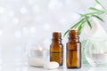 Bottle With Essential Oil, Towel And Candles On White Table. Spa, Aromatherapy, Wellness, Beauty Background.