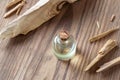 A bottle of sandalwood essential oil with white sandalwood