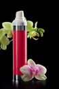 Bottle of face cream/lotion with orchid flowers Royalty Free Stock Photo