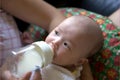 Bottle-feeding newborn baby