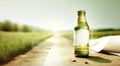 Bottle filled with cold and refreshing lemonade, glistening in the sunlight, with sliced lemons and ice cubes, perfect for a hot Royalty Free Stock Photo