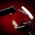 Bottle filling the glass of wine - splash of delicious flavor