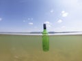 Bottle floating in sea make environment pollution Royalty Free Stock Photo