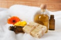 Bottle of Flower Essence, Oil and Raw Soap Royalty Free Stock Photo