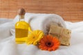 Bottle of Flower Oil and Raw Soap Royalty Free Stock Photo