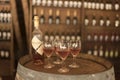 A bottle and four glasses of rose wine, on a barrel, inside the Irurtia vineyard boutique Royalty Free Stock Photo