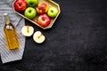 Bottle of fresh cider near autumn apples. Black background top view space for text Royalty Free Stock Photo