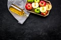 Bottle of fresh cider near autumn apples. Black background top view space for text Royalty Free Stock Photo