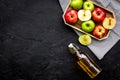 Bottle of fresh cider near autumn apples. Black background top view space for text Royalty Free Stock Photo