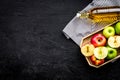 Bottle of fresh cider near autumn apples. Black background top view space for text Royalty Free Stock Photo