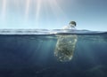 Bottle with garbage floats in the open sea. Image generated by AI Royalty Free Stock Photo